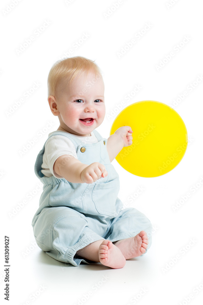 Smiling baby boy with yellow ballon in his hand isolated on whi Smiling baby boy with yellow ballon in his hand isolated on whi
