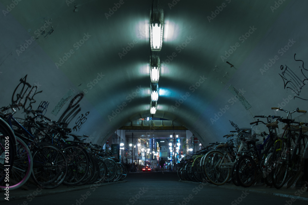 Fototapeta premium Bicycles staying calm in dark tunnel in Shibuya,Tokyo