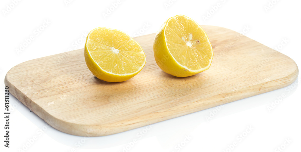 Lemon over chopping board Lemon over chopping board