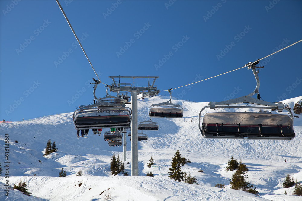 The chairlift on mountain ski resort, Kitzbuhel, Austria The chairlift on mountain ski resort, Kitzbuhel, Austria