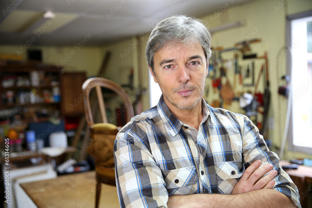 Portrait of craftsman in workshop Portrait of craftsman in workshop