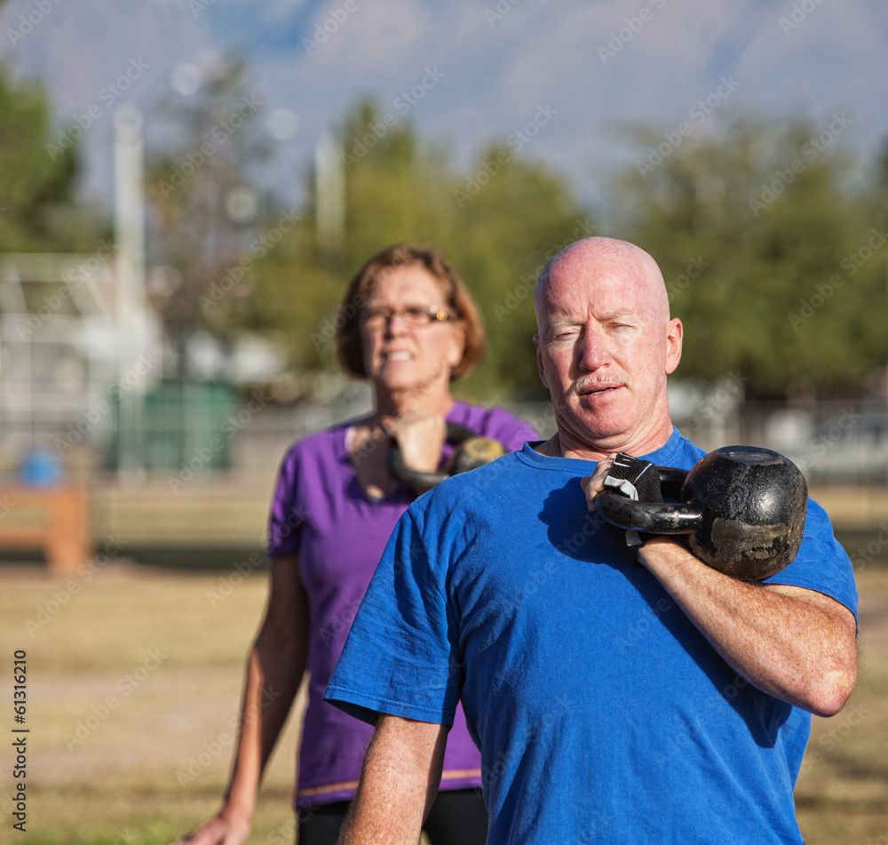 Athletic Mature Man Lifting Weights Athletic Mature Man Lifting Weights