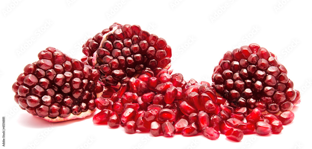 Ripe pomegranate fruit seeds isolated on a white Ripe pomegranate fruit seeds isolated on a white