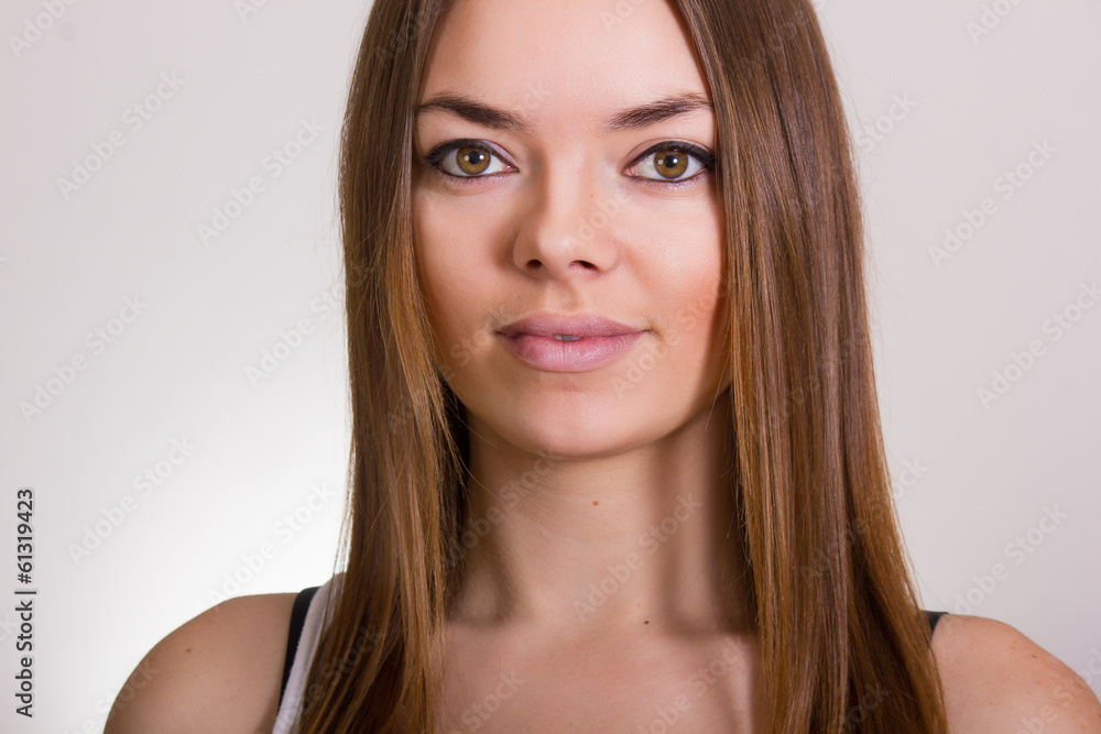 Portrait of a beautiful young woman in a white T-shirt Portrait of a beautiful young woman in a white T-shirt