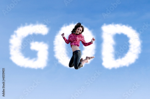 Religous woman jumping on the sky