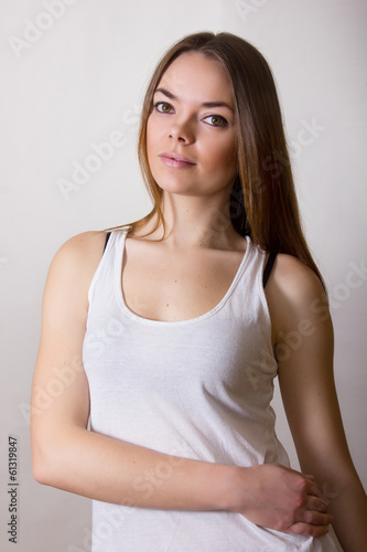 Portrait of a beautiful young woman in a white T-shirt