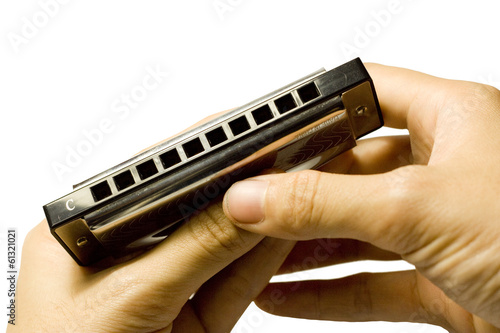 holding harmonica photo