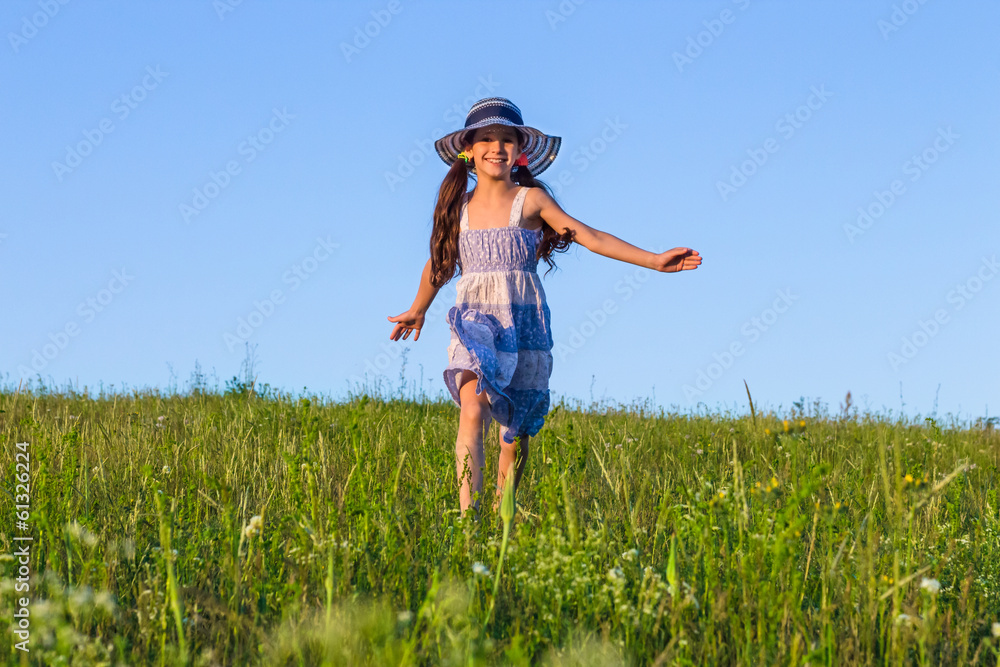 girl running on the green field girl running on the green field