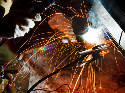 welding car turnbuckle in snow field