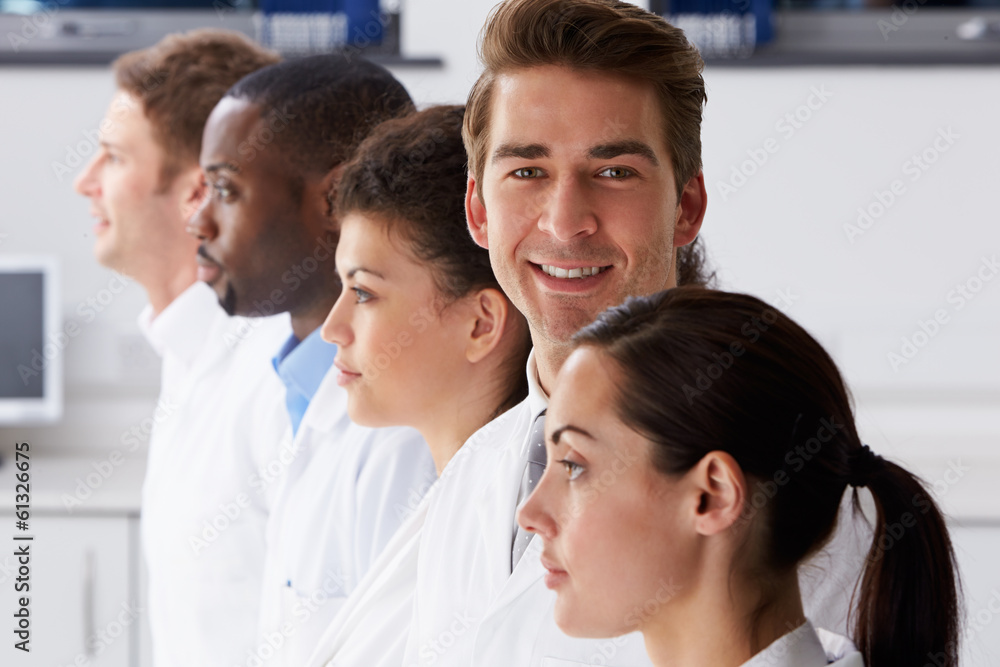 Portrait Of Technician In Laboratory With Colleagues Portrait Of Technician In Laboratory With Colleagues
