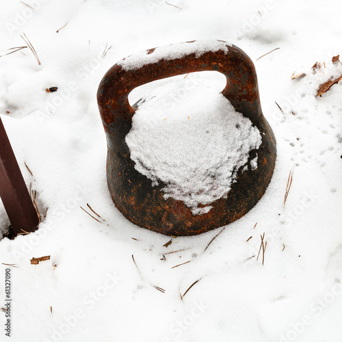 old weight in backyard under the snow