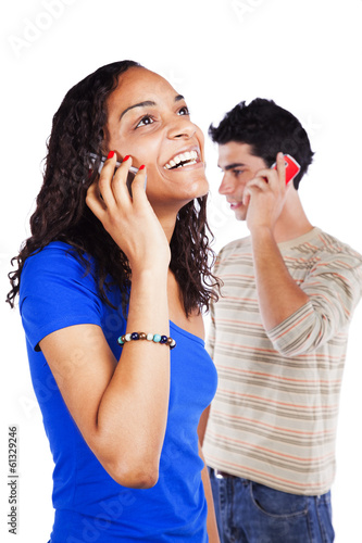 Multiracial couple holding cellphones