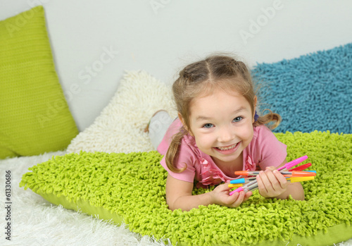 Little girl lying in bed
