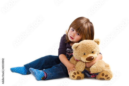bambina con orsetto di peluche photo