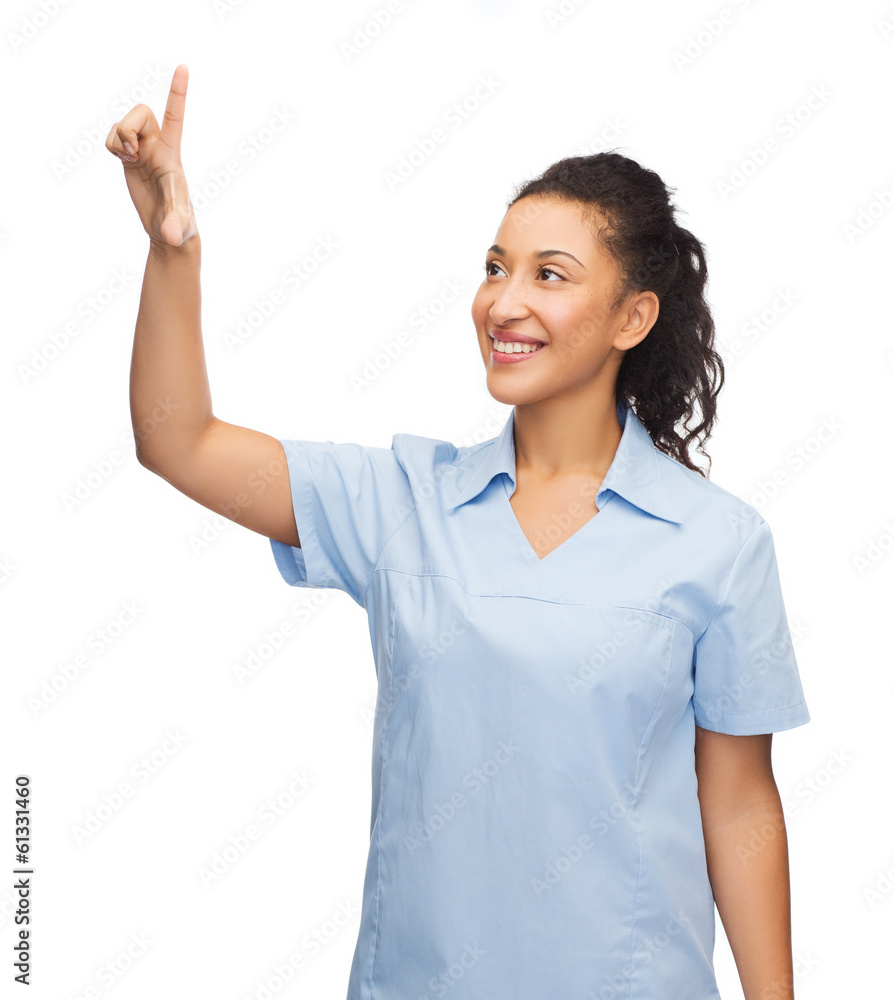 smiling doctor or nurse pointing to something smiling doctor or nurse pointing to something