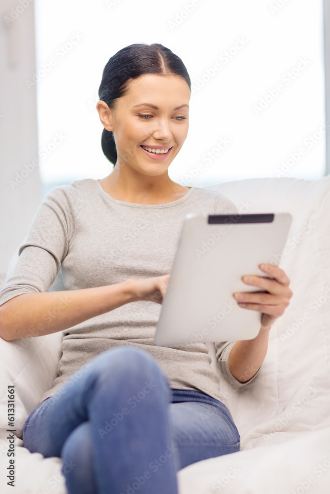 smiling woman with tablet pc computer at home smiling woman with tablet pc computer at home