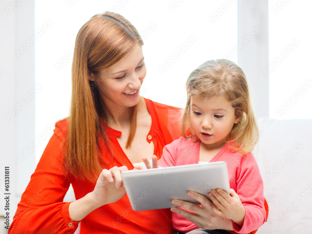 happy mother and daughter with tablet pc computer happy mother and daughter with tablet pc computer