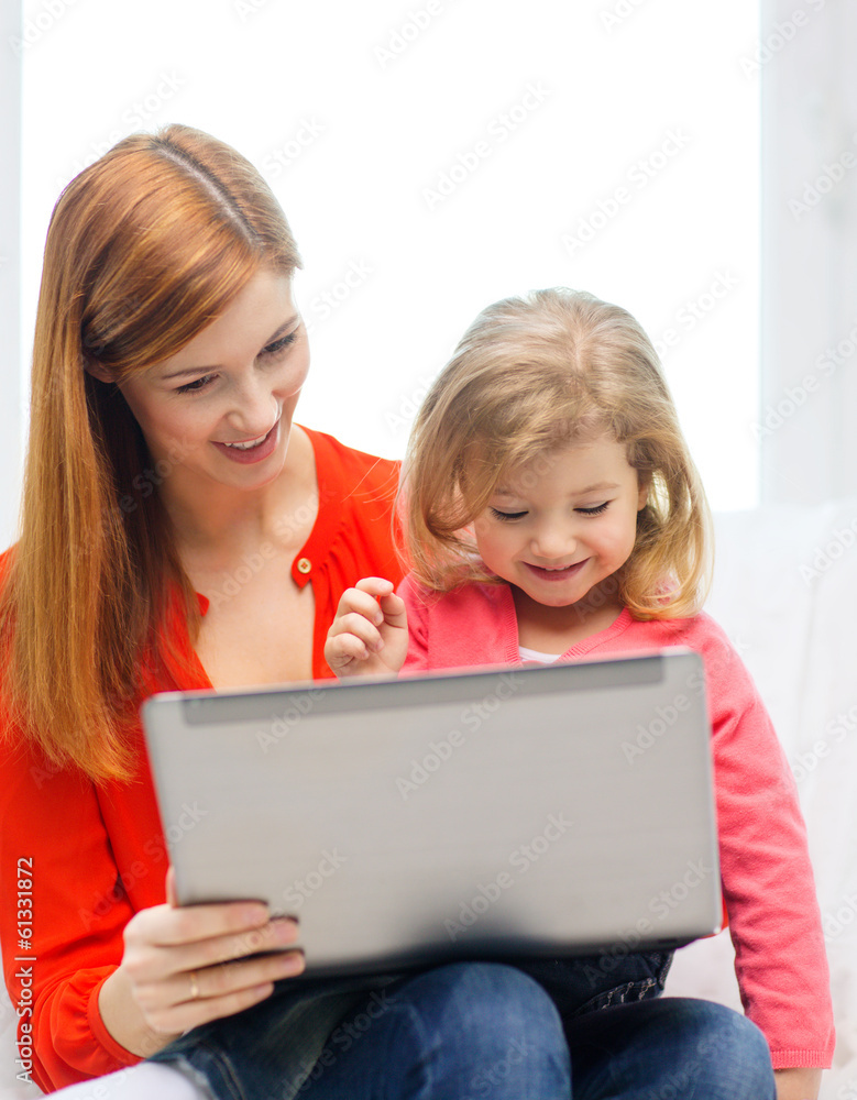 happy mother and daughter with laptop computer happy mother and daughter with laptop computer