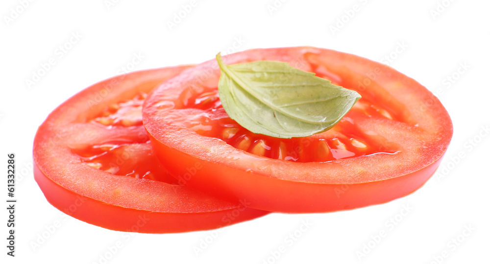 Slices of fresh tomato with basil, isolated on white Slices of fresh tomato with basil, isolated on white