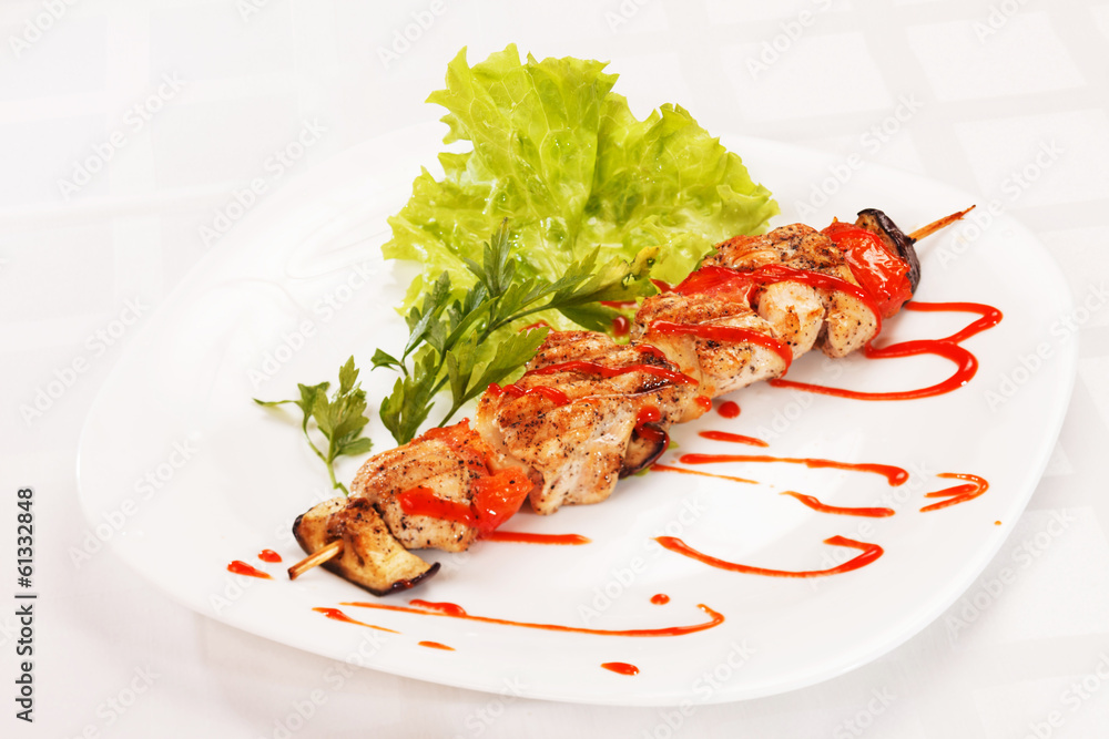 Chicken kebab with tomato sauce