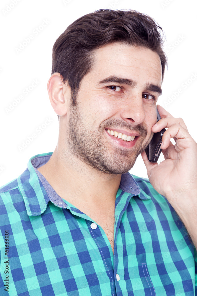 Handsome man talking on cell phone, isolated on a white backgrou Handsome man talking on cell phone, isolated on a white backgrou