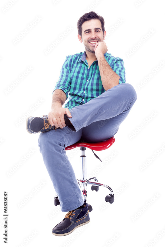 Portrait of a thoughtful man sitting on the chair, isolated on w Portrait of a thoughtful man sitting on the chair, isolated on w
