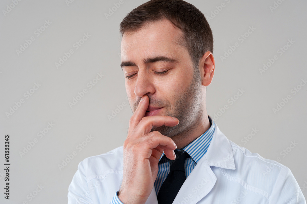 Close-up portrait of Handsome doctor male with hand on face. Goo Close-up portrait of Handsome doctor male with hand on face. Goo