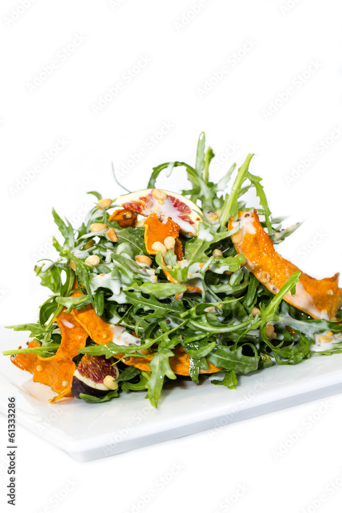 salad of arugula figs and cheese on white background salad of arugula figs and cheese on white background