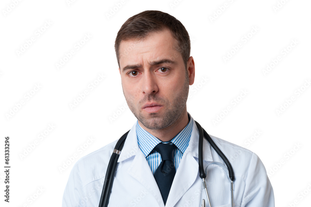 Male doctor with serious face and stethoscope around his neck Male doctor with serious face and stethoscope around his neck