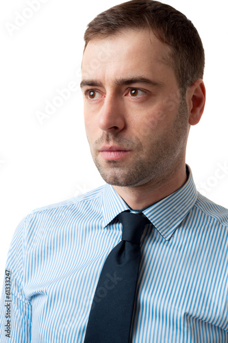 Close-up portrait of serious business man on white background