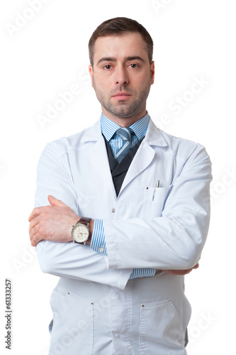 Doctor male with crossed arms and watch on hand isolated on whit © maxsaf