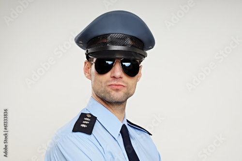 Portrait of handsome strict policemen in sunglasses © petrdlouhy