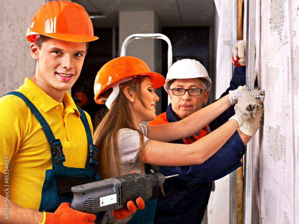 Group people in builder uniform. Group people in builder uniform.