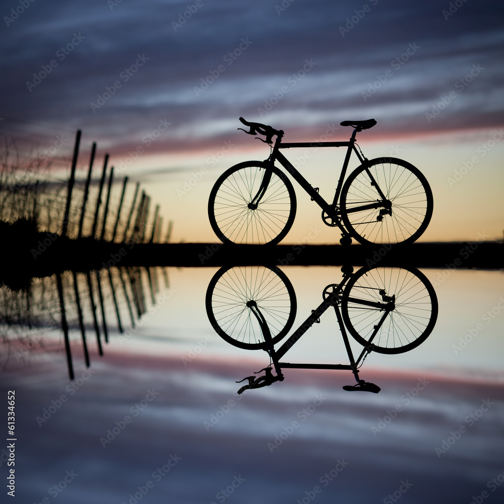 silhouette of race bike in sunset silhouette of race bike in sunset