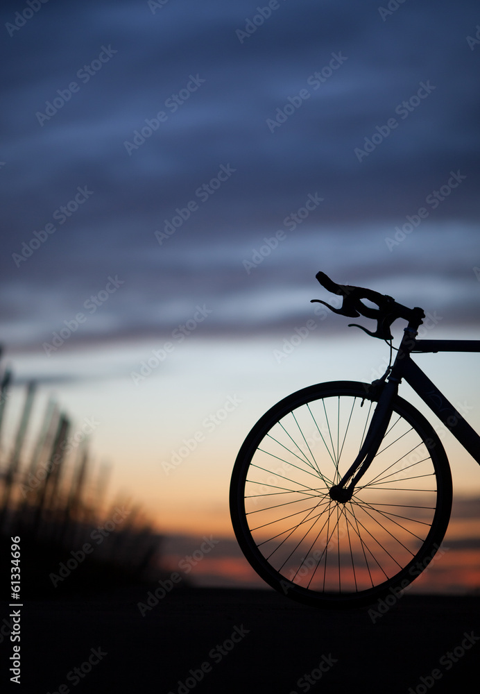 Fototapeta premium silhouette of race bike in sunset
