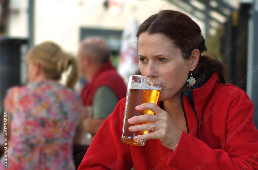 Woman drinks beer