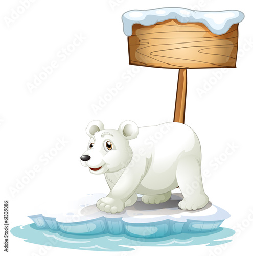 A white polar bear below the wooden signboard