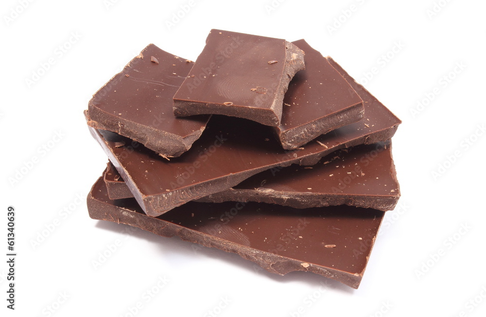 Closeup of dark chocolate pieces on white background Closeup of dark chocolate pieces on white background