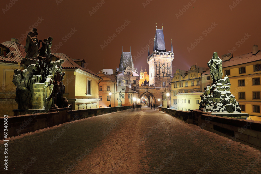 Night snowy Prague St. Nicholas' Cathedral from Charles Bridge