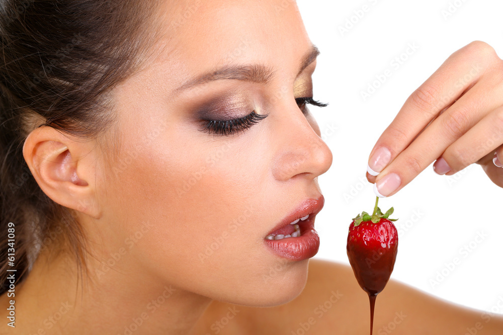Portrait of beautiful young girl with strawberry in chocolate Portrait of beautiful young girl with strawberry in chocolate