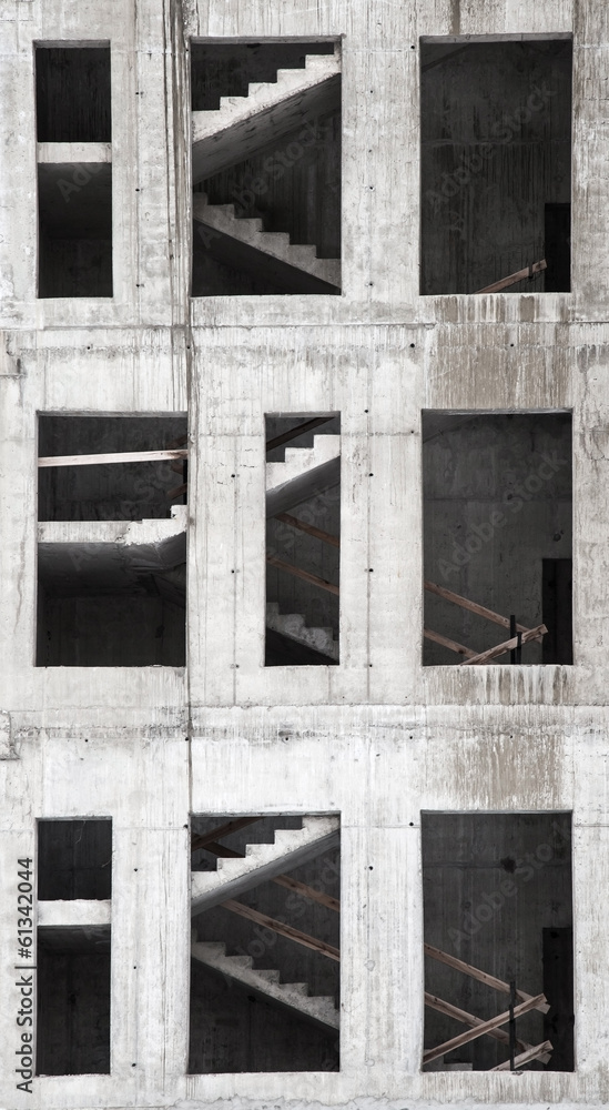 Building under construction, concrete wall with stairs