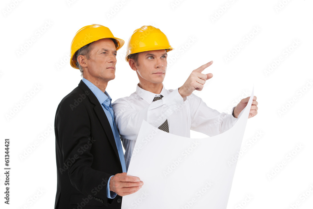 two serious older man standing. two serious older man standing.