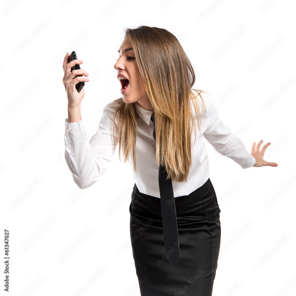 Girl talking to mobile over isolated background. Girl talking to mobile over isolated background.