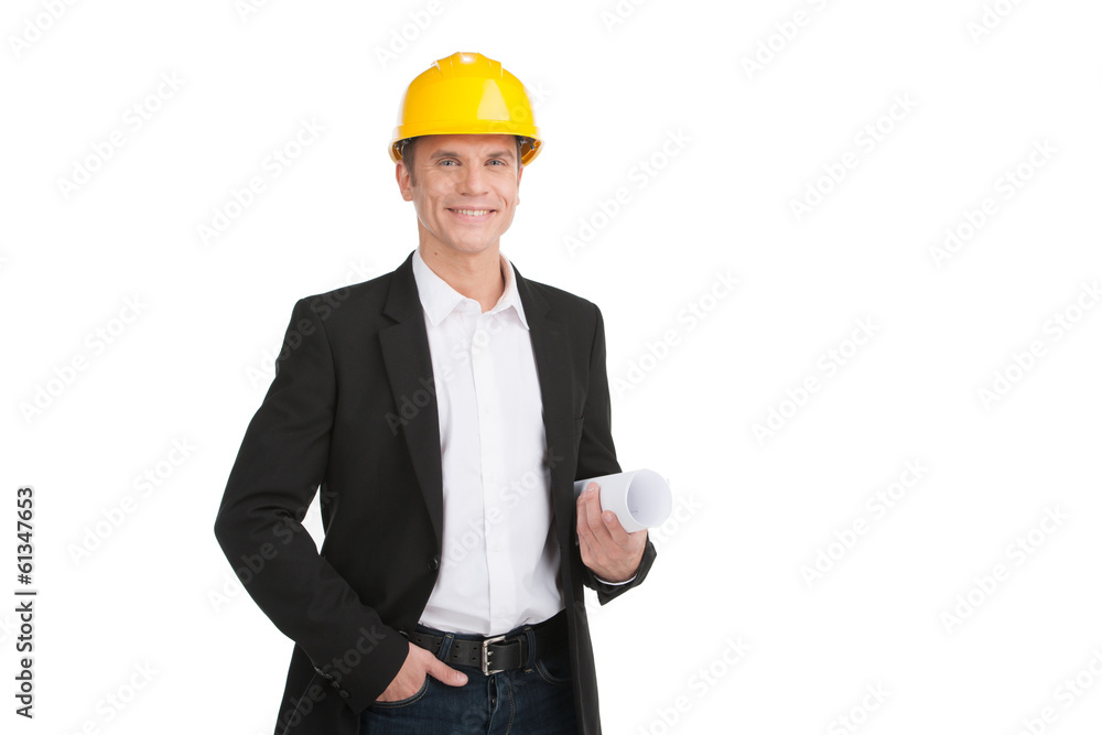 professional builder wearing helmet and smiling.