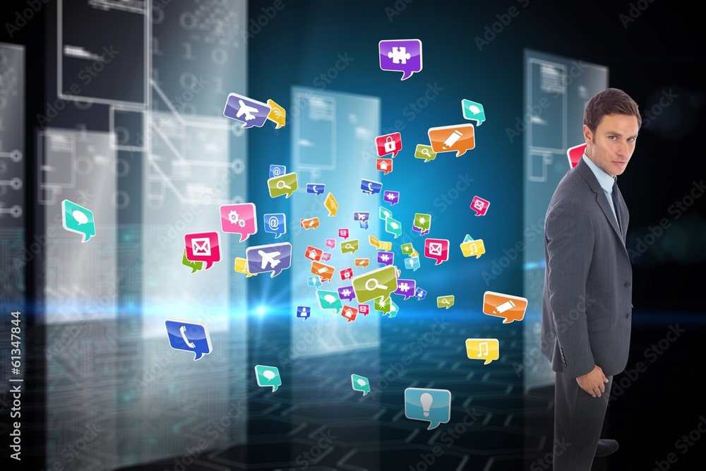 Composite image of serious businessman standing Composite image of serious businessman standing