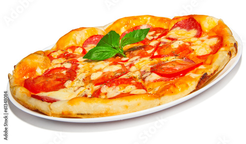 Pizza with salami, cheese and tomato, fast food on plate
