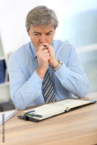 Businessman with worried expression on his face