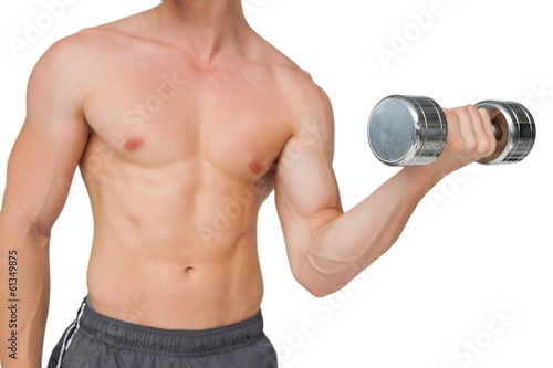 Fit shirtless man lifting dumbbell