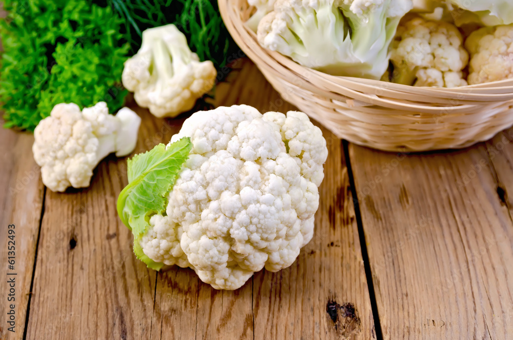 Cauliflower with a basket on the board Cauliflower with a basket on the board