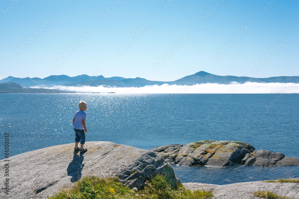Little boy enjoying view at fjord